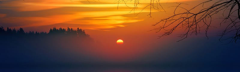 An image showing a beautiful sunset transition from yellow, to purple.