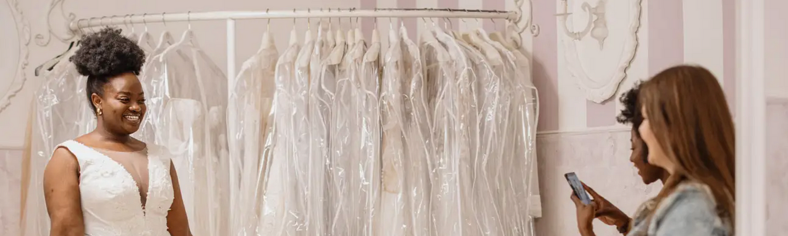 A woman tries on a wedding dress.