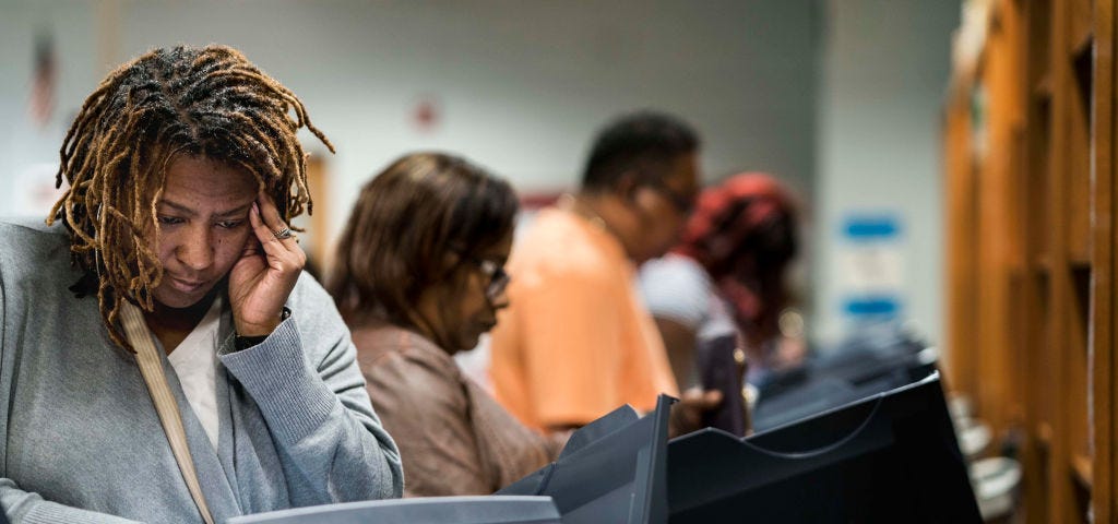 A photo of black voters at the poll in Georgia.