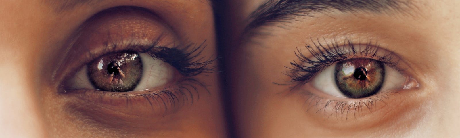 Intense close up of the eyes of two people.