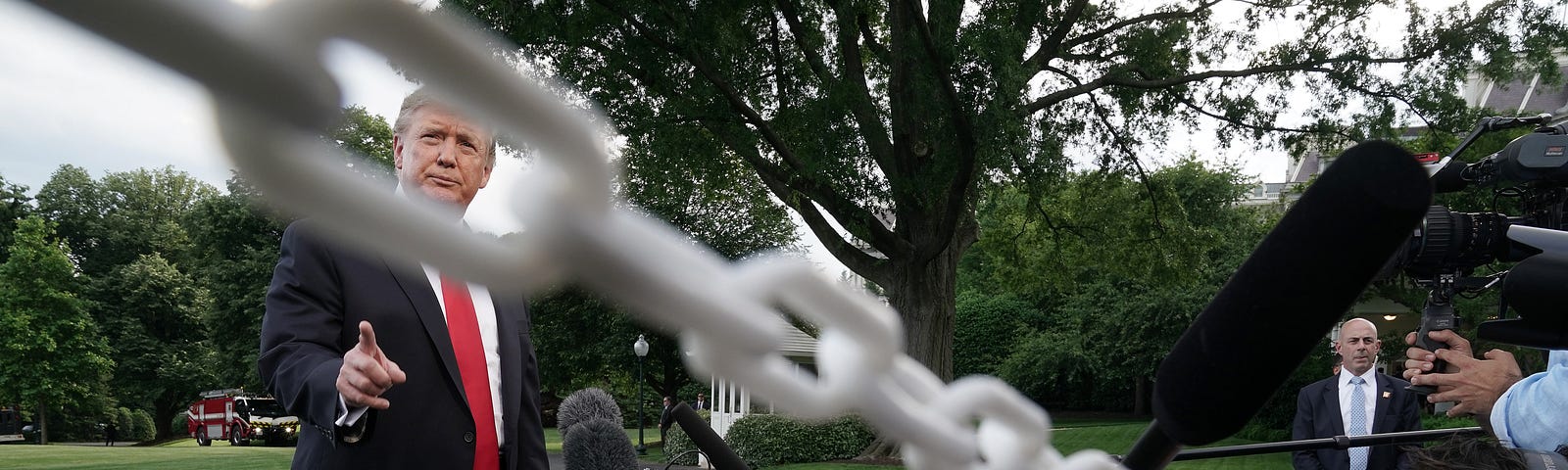 President Donald Trump talks to journalists as he departs the White House for a campaign rally in Pennsylvania May 20, 2019