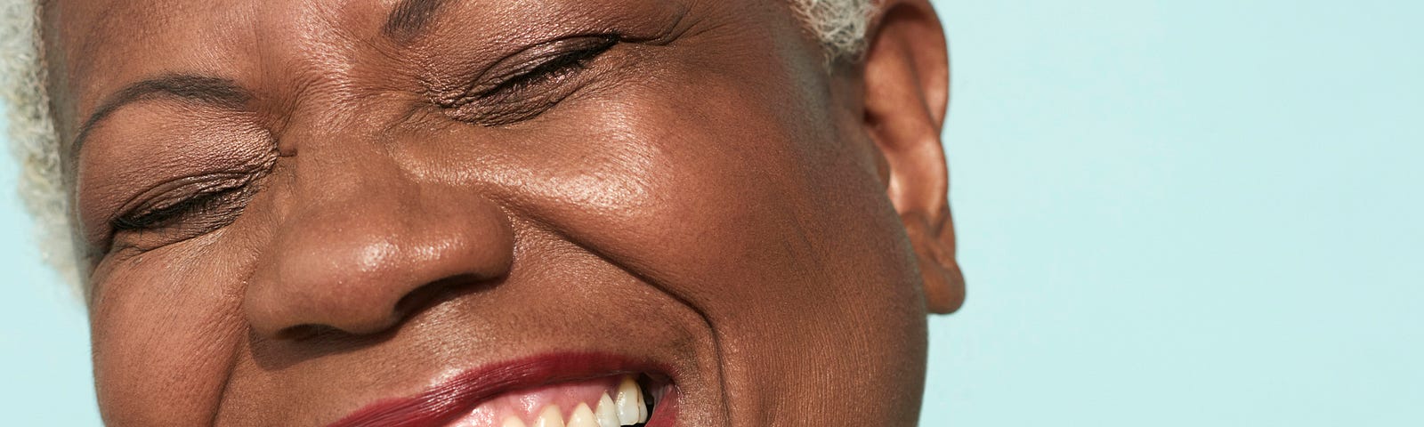 Closeup of a woman’s smiling face.