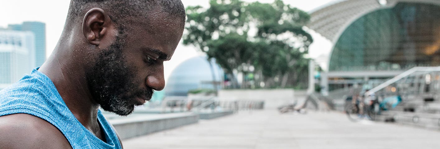 The author sat cross legged meditating on his yoga mat at Marina Bay Sands in Singapore.