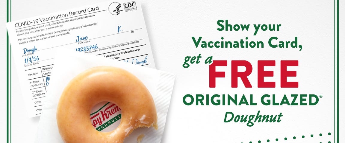 A promotional graphic with a partially eaten Krispy Kreme doughnut above a Covid-19 vaccination card, next to the text “Show your Vaccination Card, get a FREE Original Glaze Doughnut”