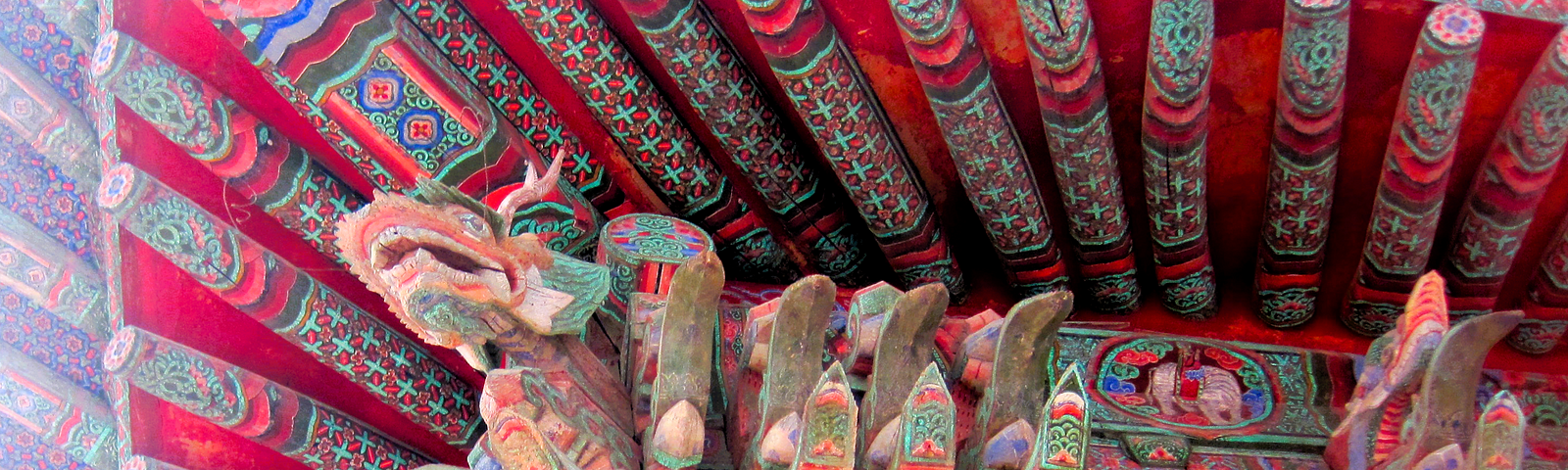 Colorful dragons on corners of roof in Buddhist temple