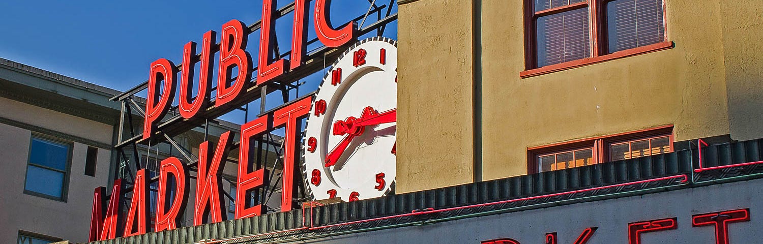 A sign welcoming you to Pike Place Market in Seattle.