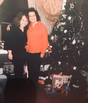 Mom and me next to Christmas tree