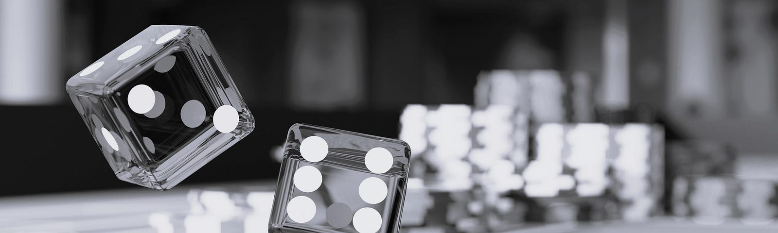 Photo of dice being tossed above a gambling table in a casino.