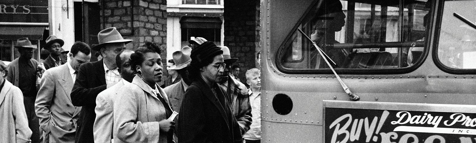 Rosa Parks waits to board a bus at the end of the Montgomery bus boycott