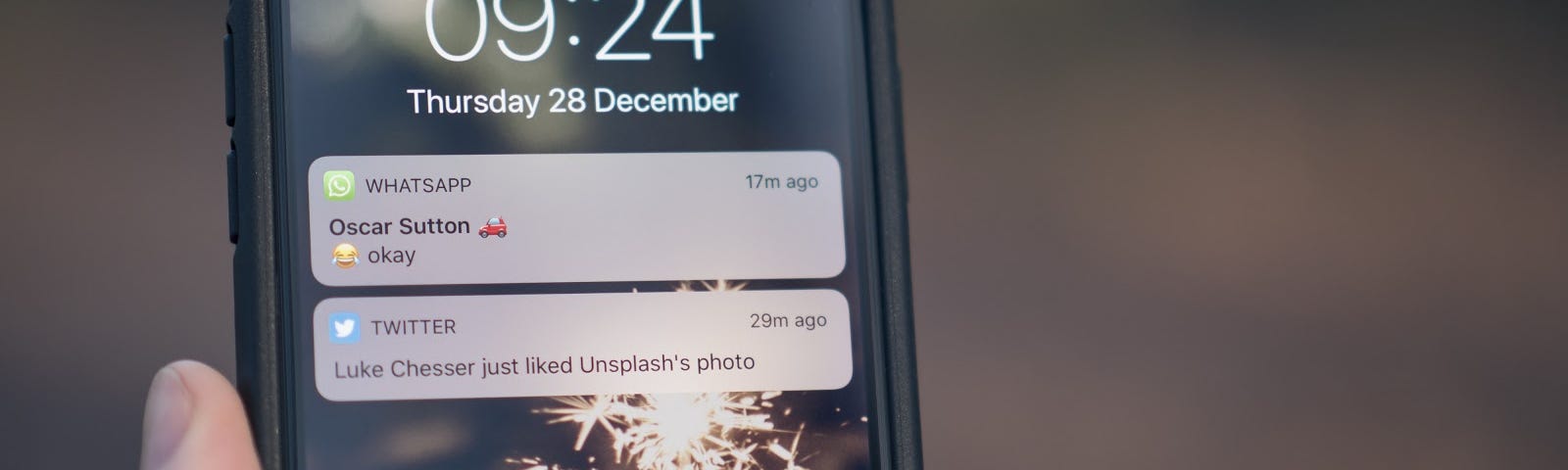 A close up of a phone home screen with 1 text message and 1 Twitter notification.