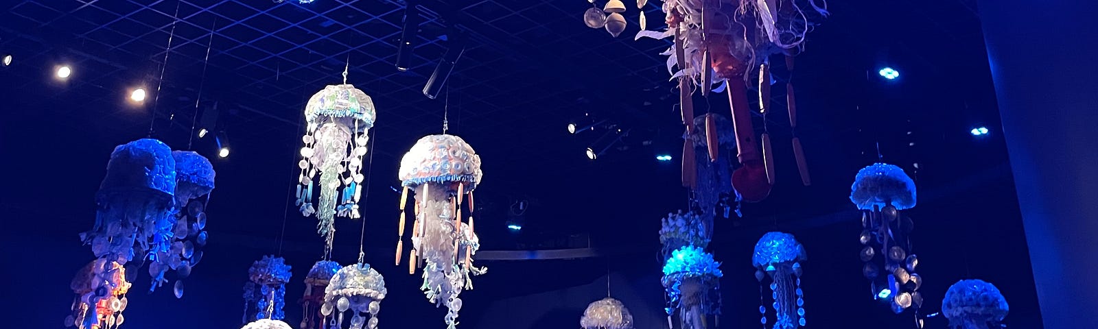 A smack of jellyfish made of repurposed ocean plastic hang at the New York Aquarium