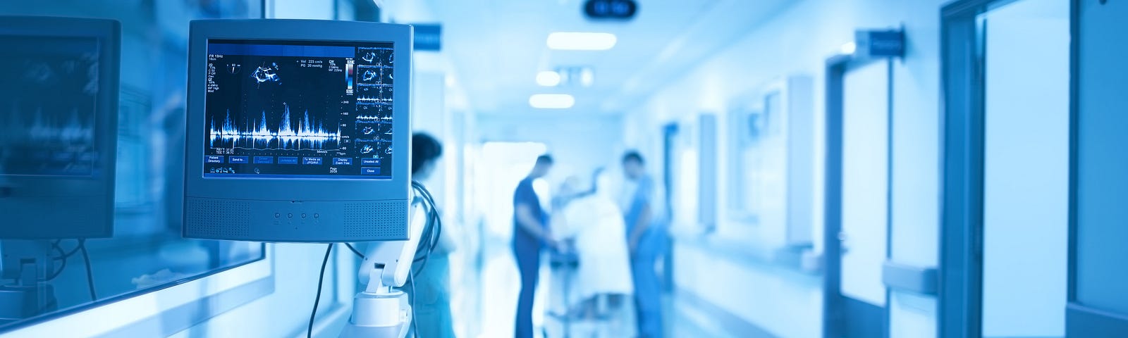 Medical equipment on the background of group of health workers in the ICU.