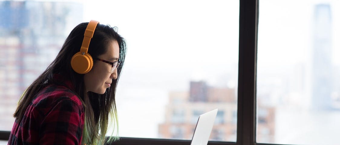 A person sits by a window and types on a laptop. #typing #work #writing #laptop #workfromhome #cafe