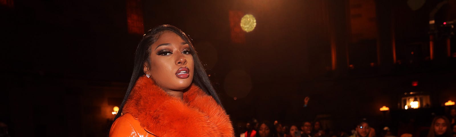 Megan Thee Stallion onstage in front of a crowd.