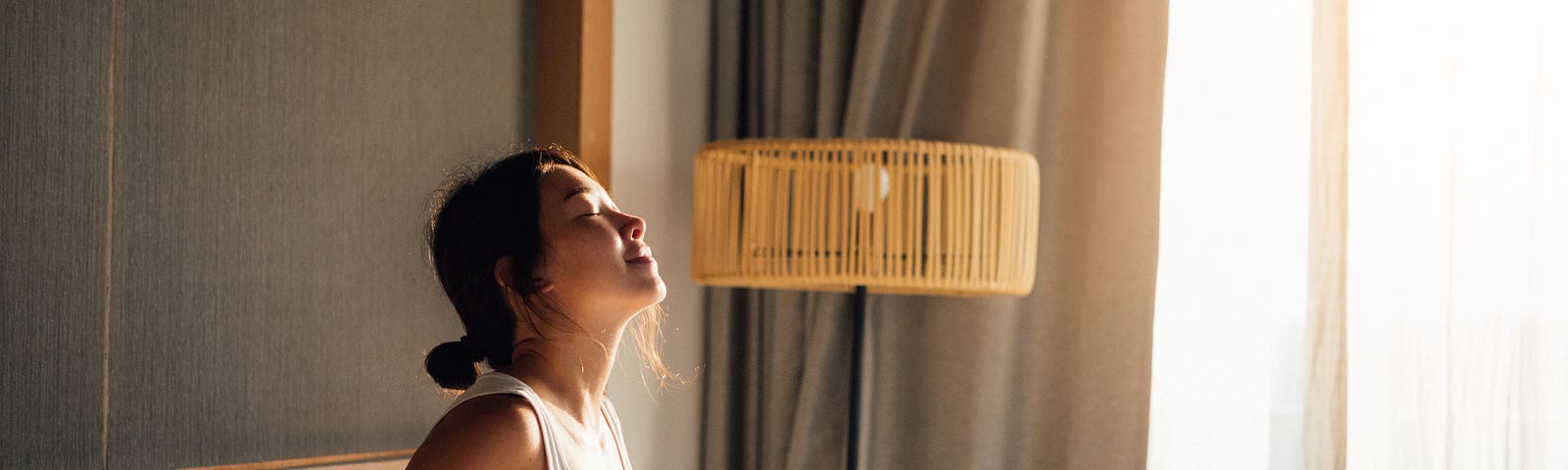 Woman getting out of bed ready to face the day.