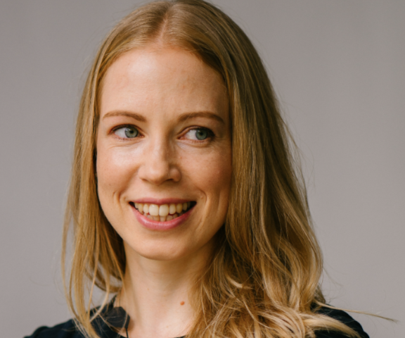 Picture of a smiling woman with long hair