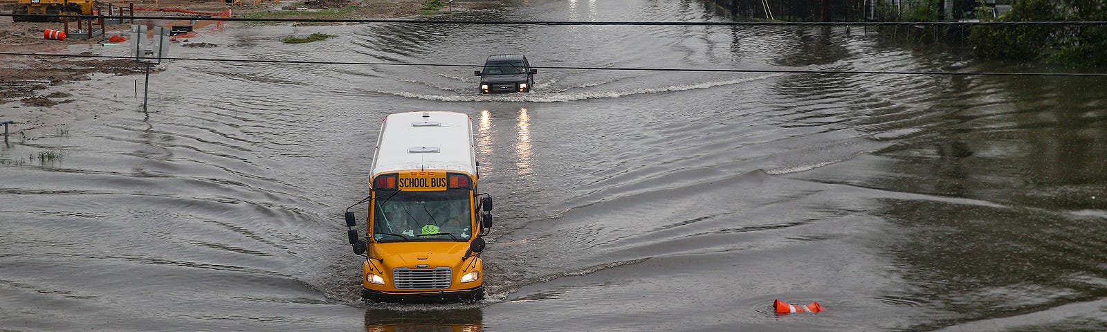 A photo of a school bus making its way on the flooded Hopper Rd. on September 19, 2019 in Houston, Texas.