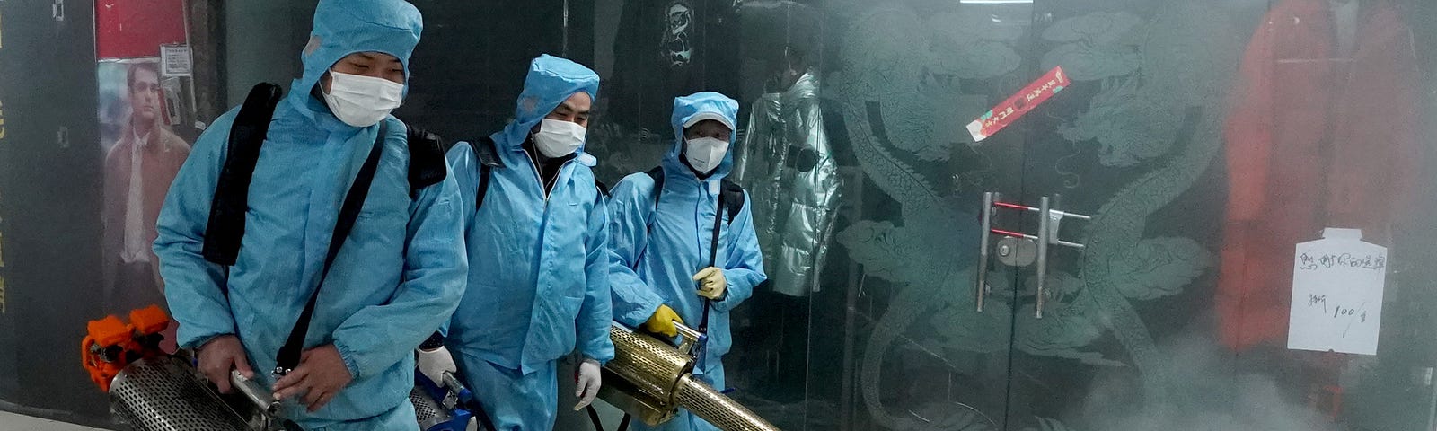 Staff members disinfect a shopping mall at the Hanzheng Street in Wuhan.