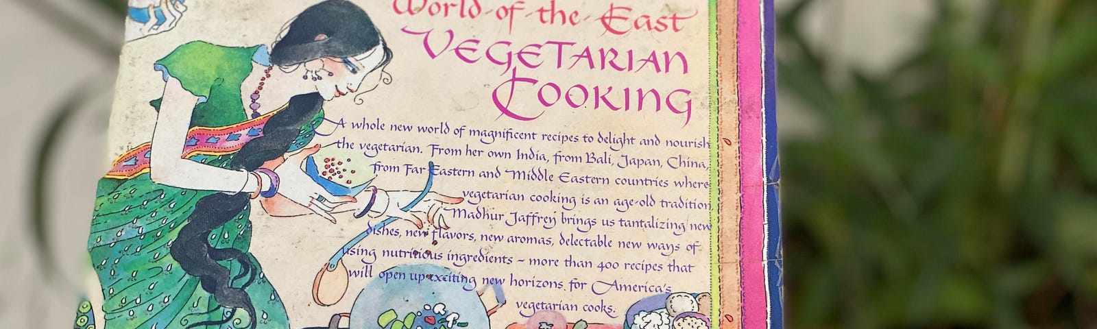 Madhur Jaffrey’s World of the East Vegetarian Cookbook book cover is pictured, with an Asian-inspired font and illustration