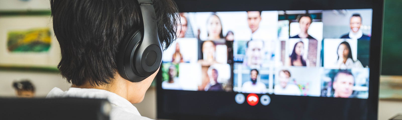 Woman working at home having a video conference with colleagues