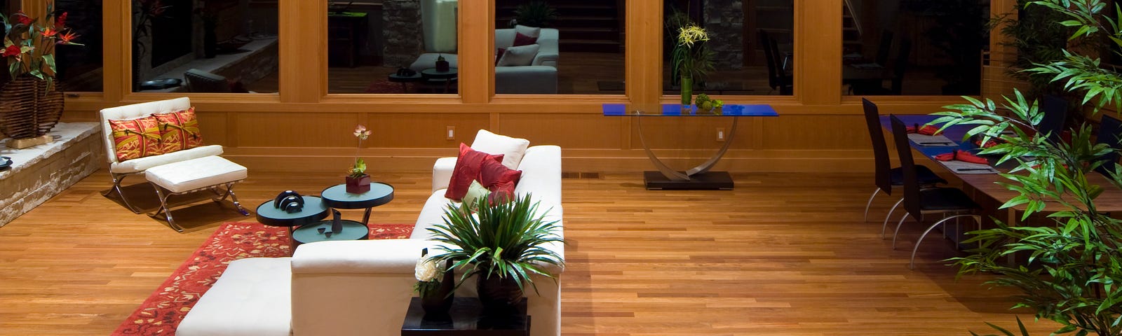 A clean and spacious living room with twilight view.