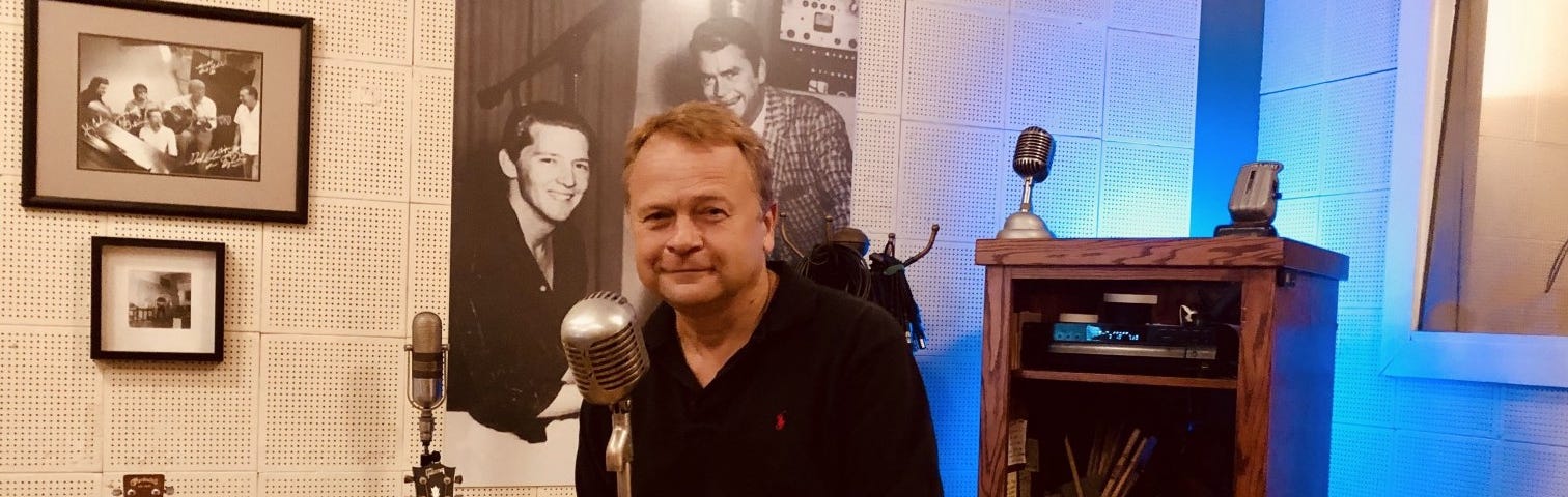 Joseph Serwach with the world’s most famous microphone at the iconic Sun Studios in Memphis, Tennessee, where music legends including Elvis Presley, Johnny Cash, Carl Perkins, and Jerry Lee Lewis began their careers, and a beautiful new thing called rock and roll. Image by Debra Serwach.