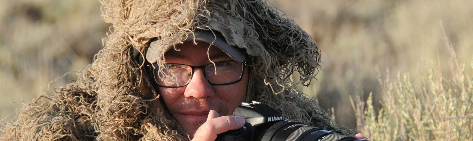 Tom Koerner, in his camoflauge ghillie suit, is one with his surroundings.