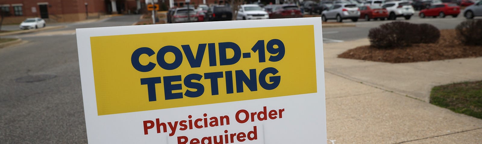 Signs directing patients to a COVID-19 virus testing drive-up location outside Medstar St. Mary’s Hospital on March 17, 2020.