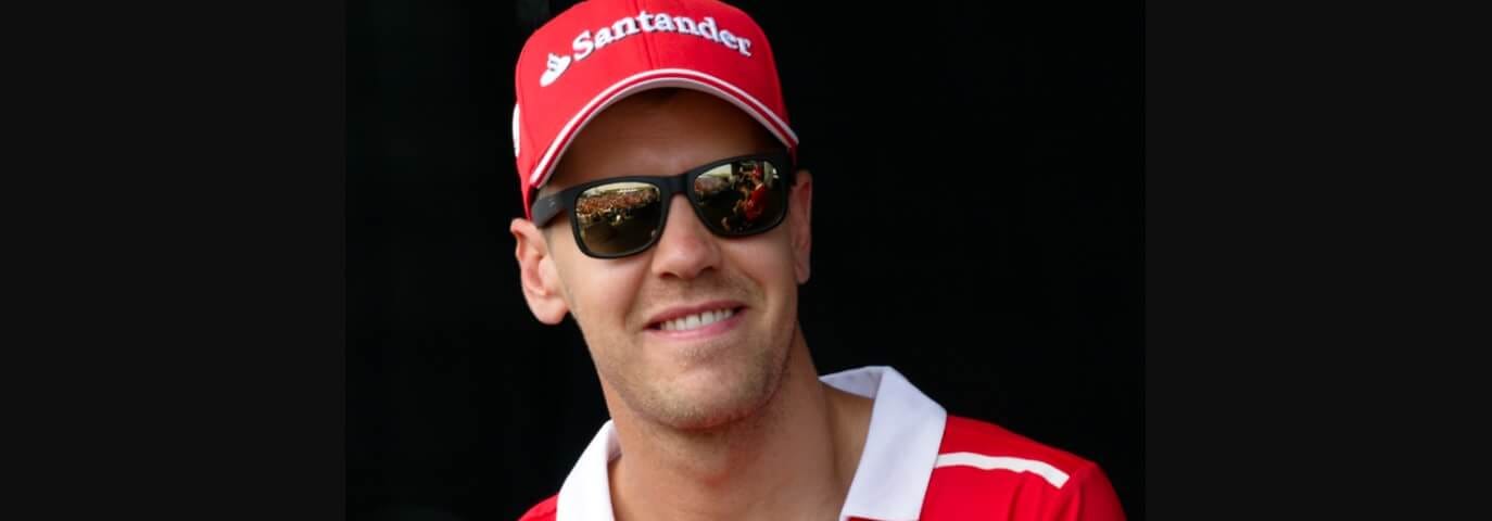 Formula One driver Sebastian Vettel wearing a red Ferrari polo shirt at a fan meeting during the Malaysian GrandPrix at the Sepang International Circuit, Selangor.