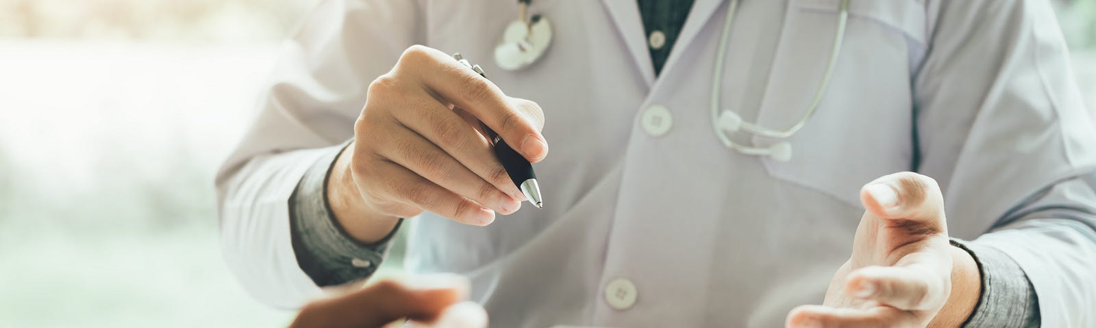 A doctor talking to the patient about their diagnosis.