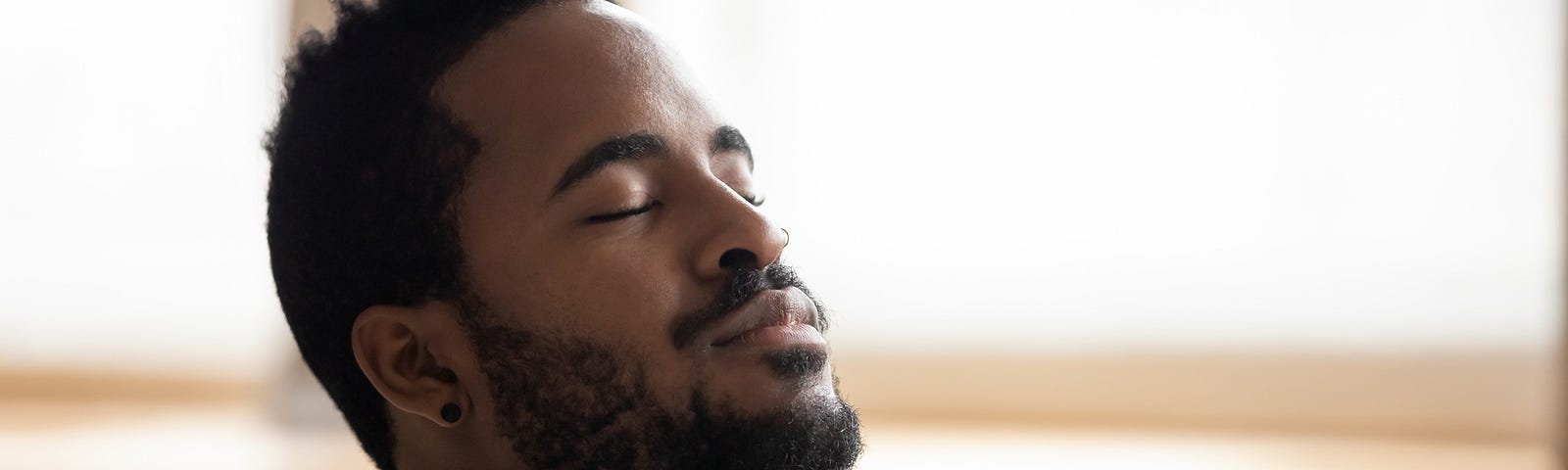 Tranquil man resting his eyes.