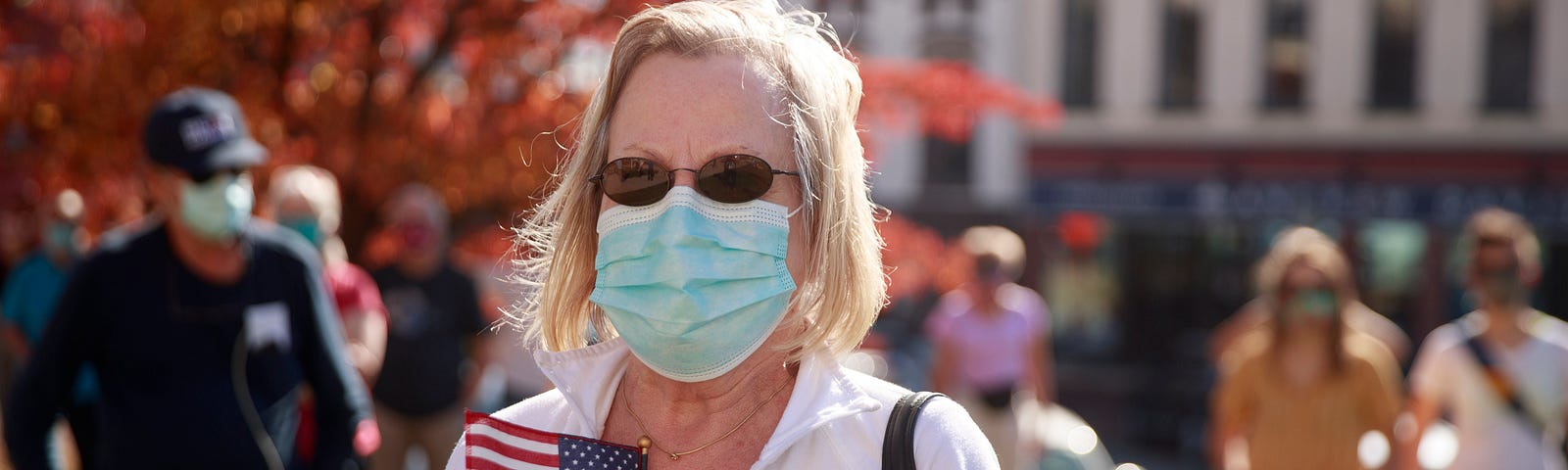 A woman seen with an American flag gathering at a Protect the Results rally at the Monroe County courthouse in Indiana