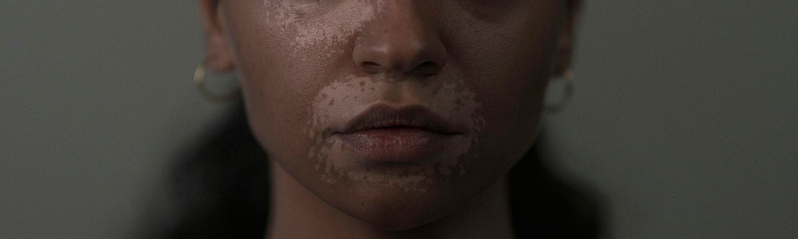 A woman looking deeply in the eyes — representing the journey from self-harm recovery to healing, with a focus on coping strategies and mental health support.