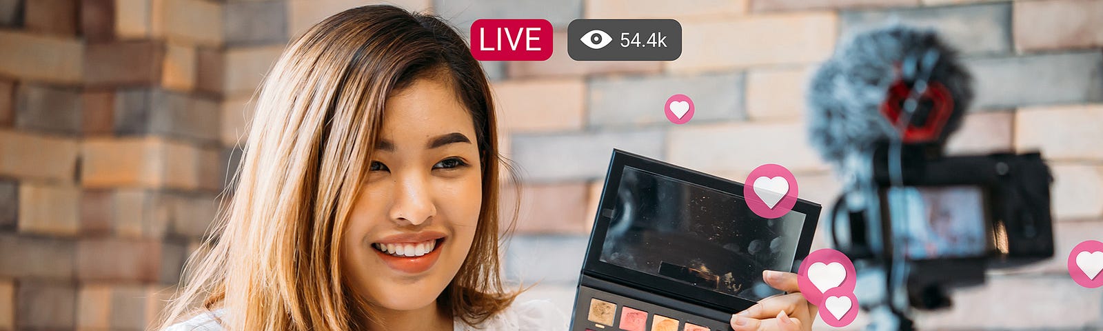 Young girl showing makeup kit while live streaming to audience on social media