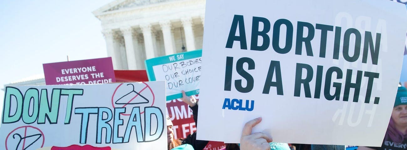 Pro-choice activists protest during outside the US Supreme Court on March 4, 2020.