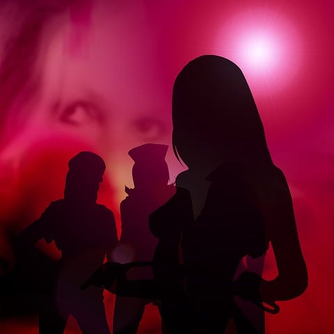 Silhouettes of three shapely women on a red background which shows out of focus shots of women’s faces