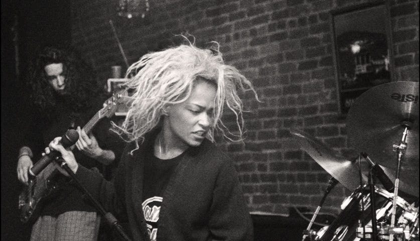 Black and white photo of Tina Bell performing.