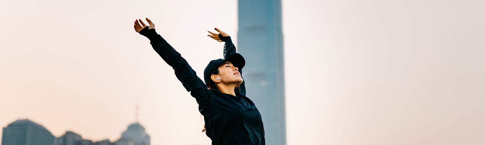 Woman stretching outside.