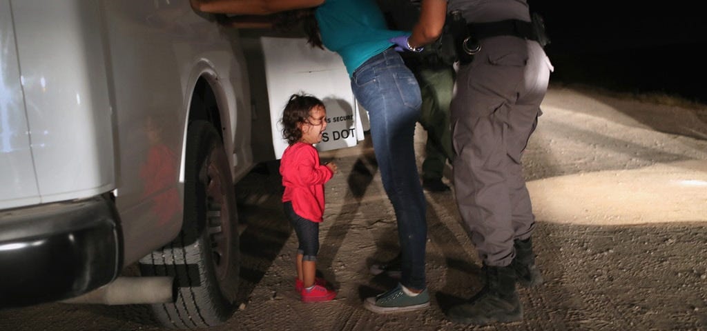 MCALLEN, TX - JUNE 12: A two-year-old Honduran asylum seeker cries as her mother is searched and detained near the U.S.-Mexico border on June 12, 2018 in McAllen, Texas. The asylum seekers had rafted across the Rio Grande from Mexico and were detained by U.S. Border Patrol agents before being sent to a processing center for possible separation. Customs and Border Protection (CBP) is executing the Trump administration's zero tolerance policy towards undocumented immigrants. U.S. Attorney General Jeff Sessions also said that domestic and gang violence in immigrants' country of origin would no longer qualify them for political asylum status. (Photo by John Moore/Getty Images)