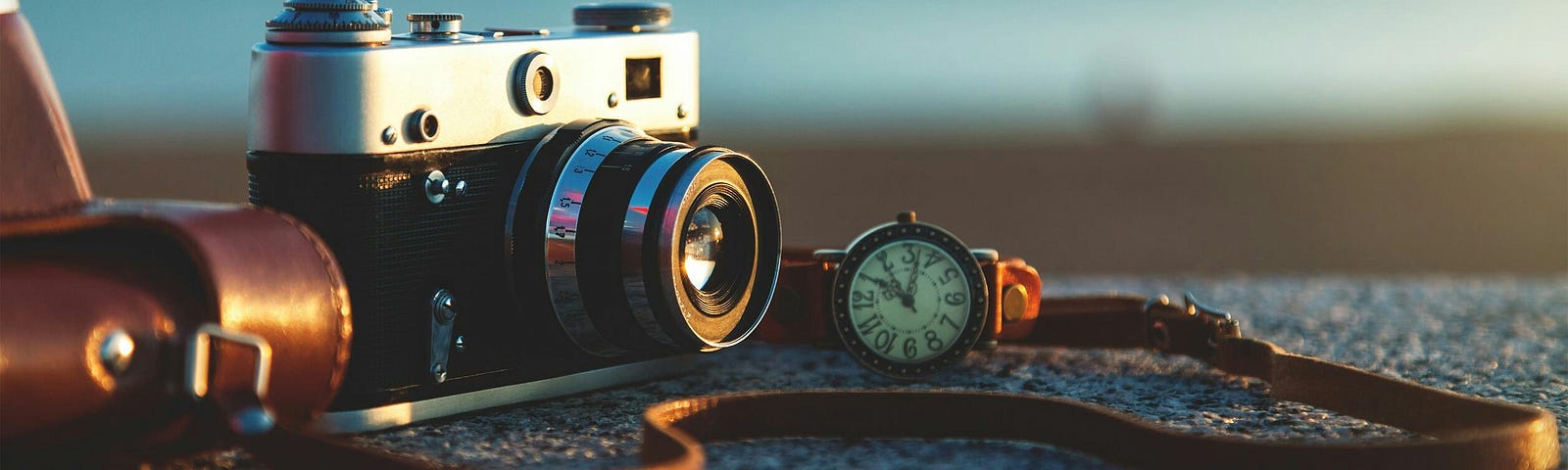 A photo of a close-up of a camera on a rock.