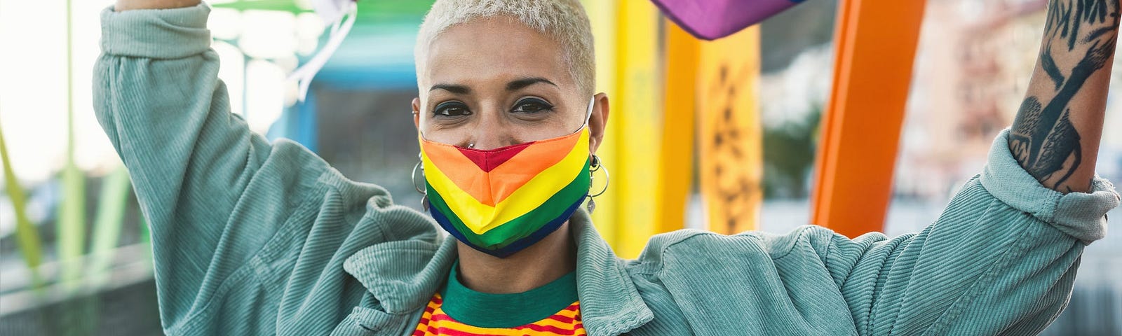 An individual holding a pride flag.