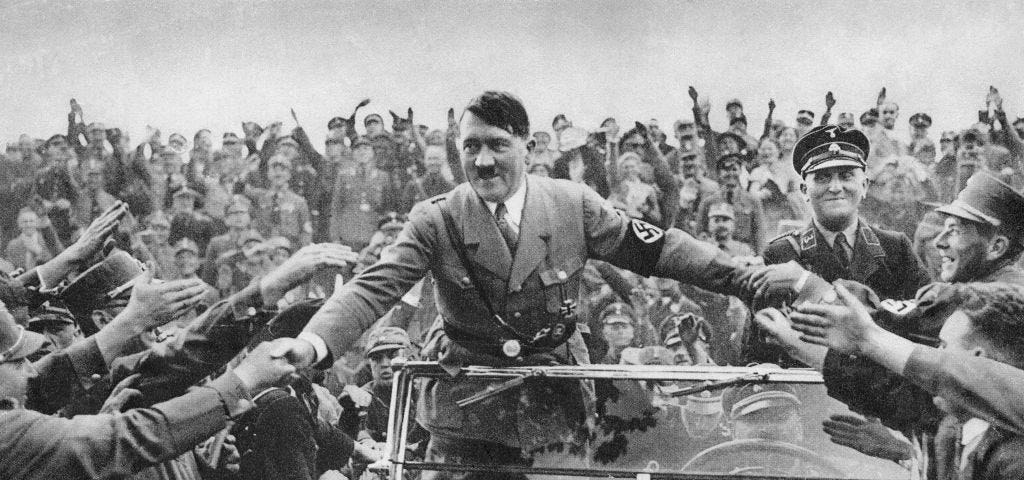 An archival photo of Hitler in the midst of a crowd in Nuremberg.
