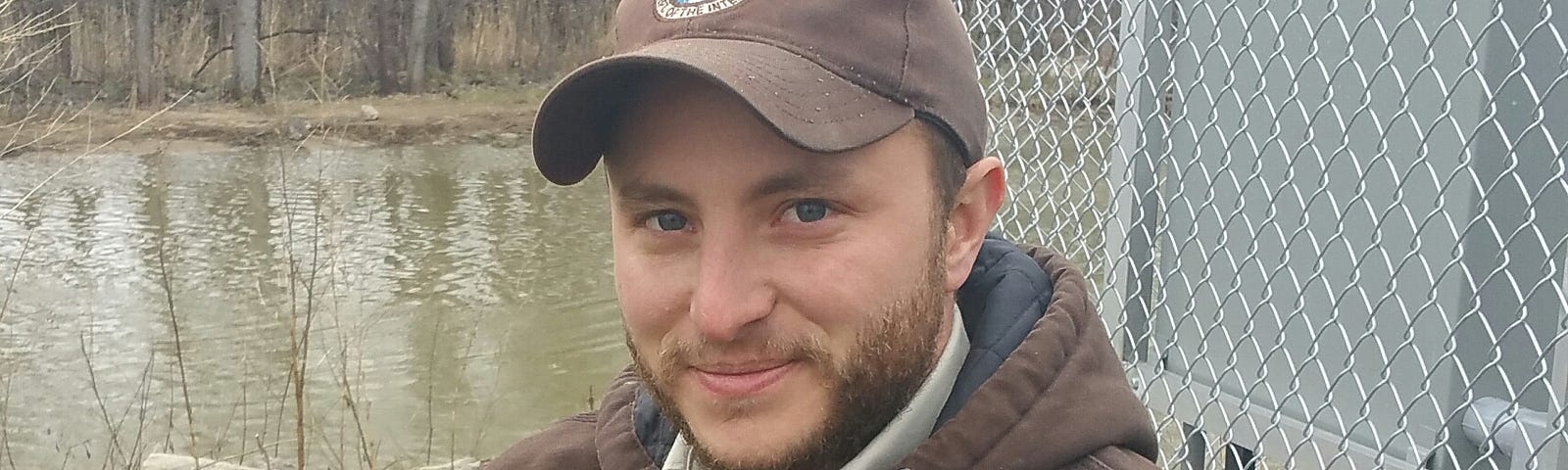 Jake Bonello, FWS Scholar working at the Detroit International Wildlife Refuge rescuing a bird in need.