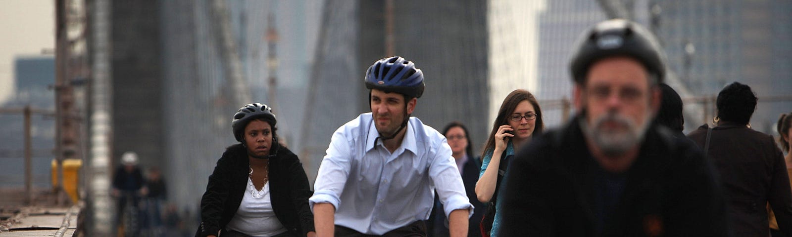 Bicycle commuters crossing the Brooklyn Bridge in New York City.