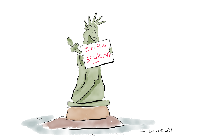 Lady Liberty holding a placard that says, I’m still standing. Cartoon by Liza Donnelly. Used with permission.