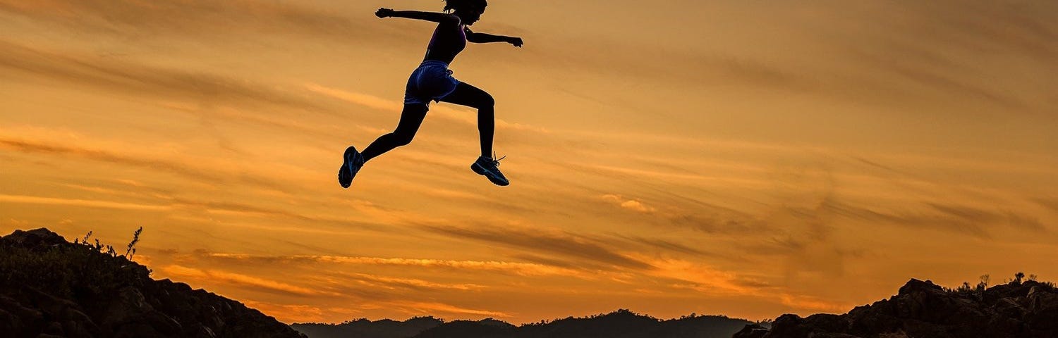 woman leaping across a wide gap