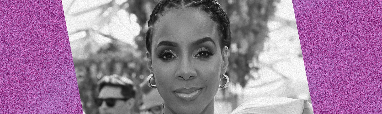 Black and white photo of Kelly Rowland against a violet background.