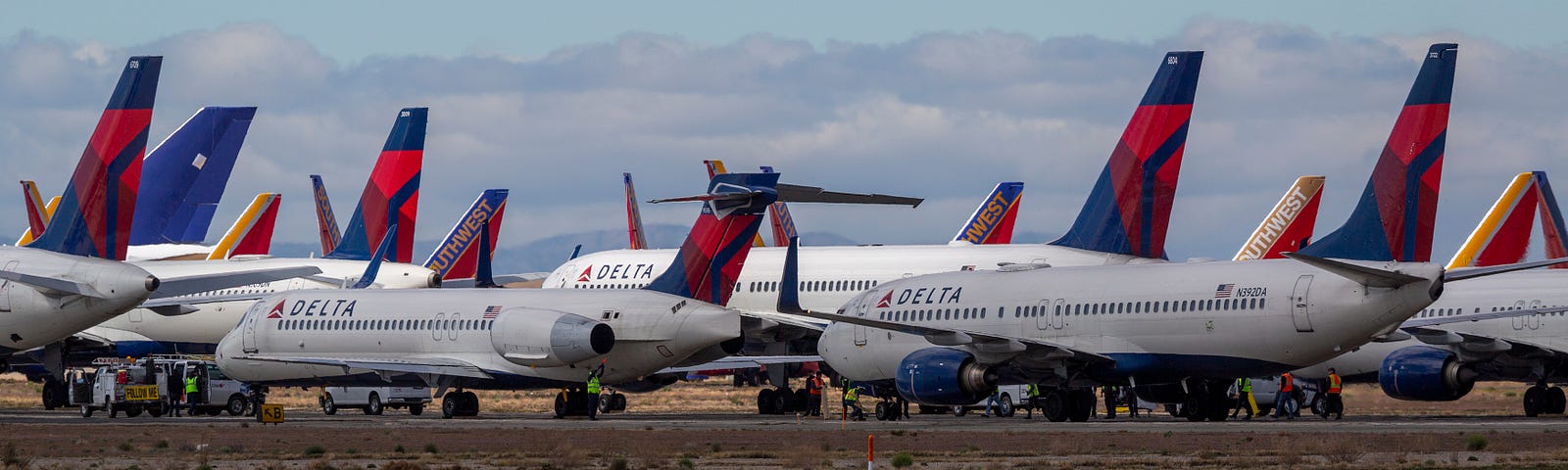 A fleet of Delta Airlines jets parked at the Southern California Logistics Airport (SCLA) due to decreased air travel.