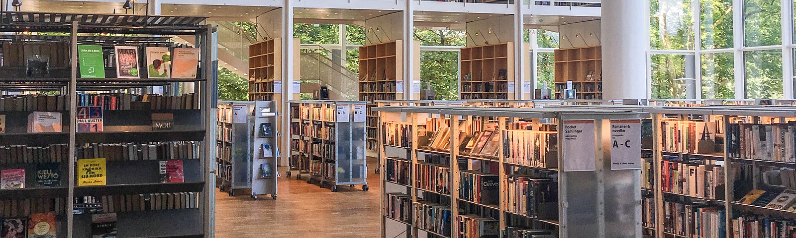 A modern library with huge windows for walls.