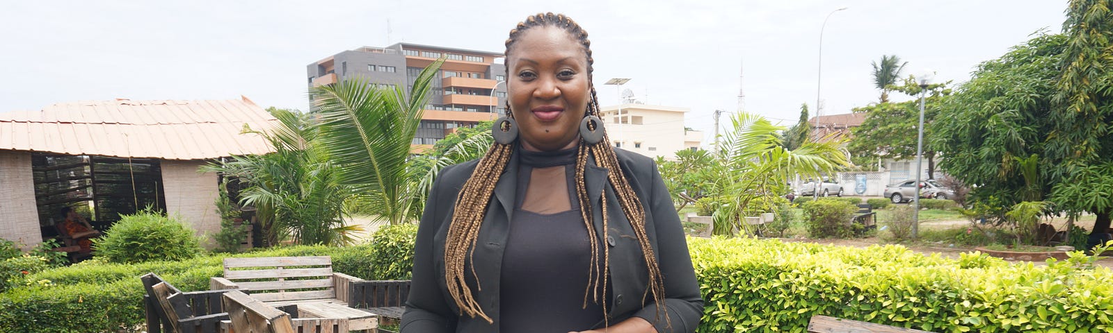 Ayaba Totin, holding some books from a typical delivery of Ayaba’s Box of Books.